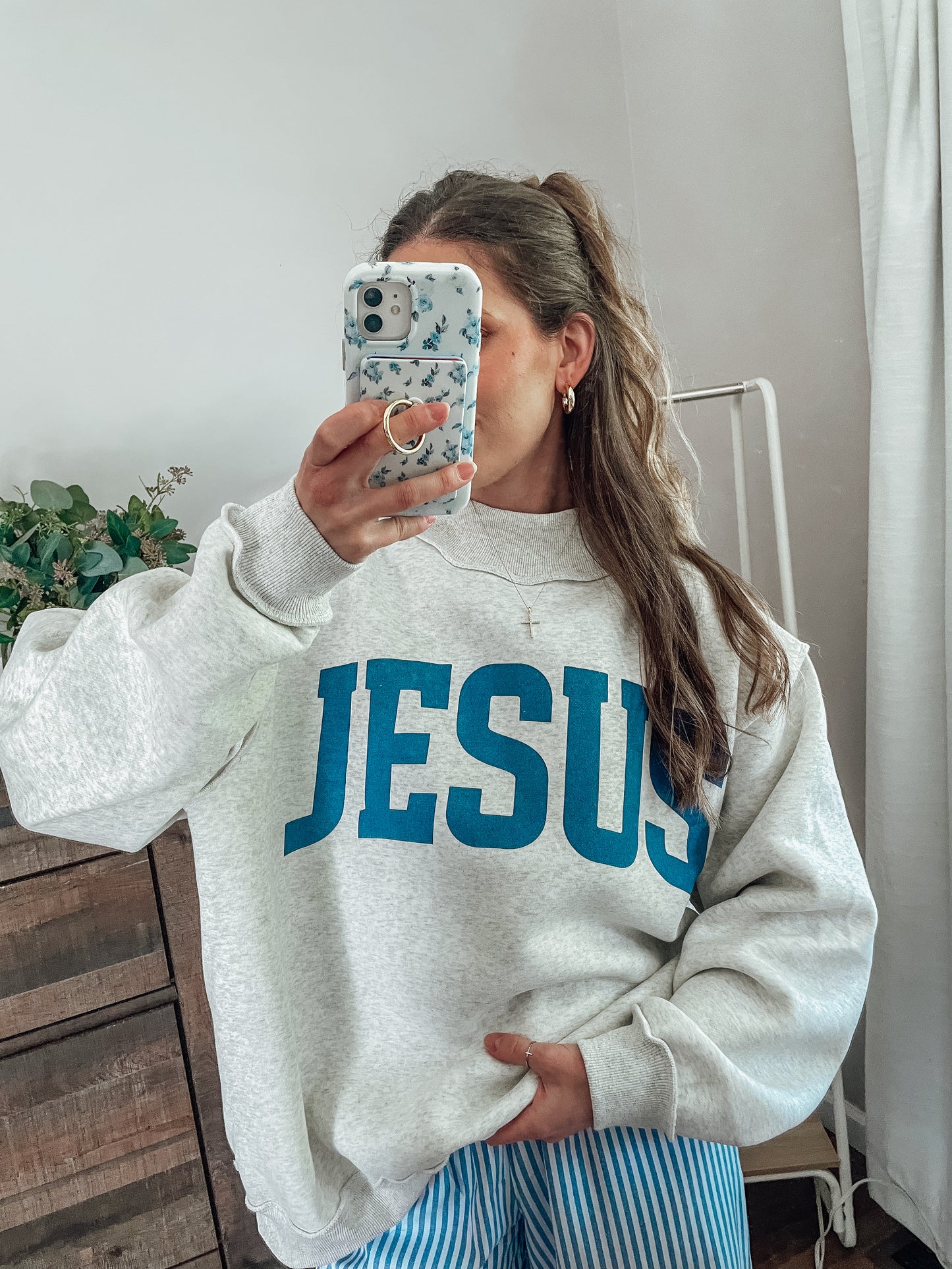 ‘Jesus & God is good’ reversible mockneck sweater
