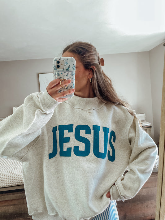 ‘Jesus & God is good’ reversible mockneck sweater